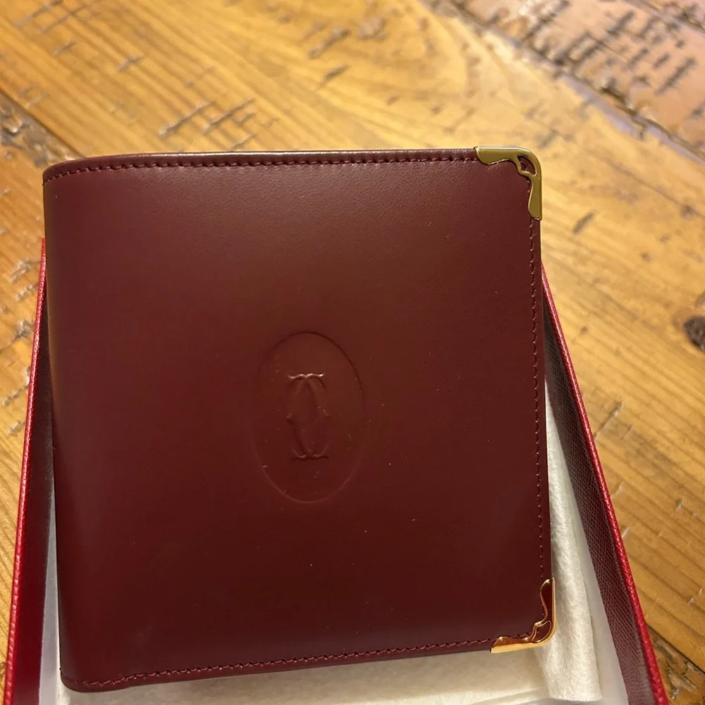 Cartier Deep Burgundy Leather bifold Gold Corner Hardware
